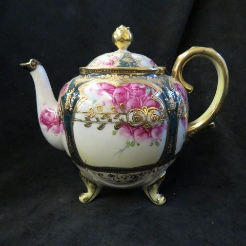 Nippon Porcelain Teapot,: handpainted floral with fancy gold work, footed, excellent.
