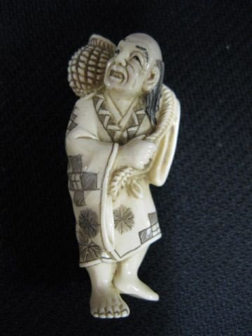 Carved ivory Netsuke of an Old Man,: fine polychrome, basket on his shoulders, signed, 2, excellent."