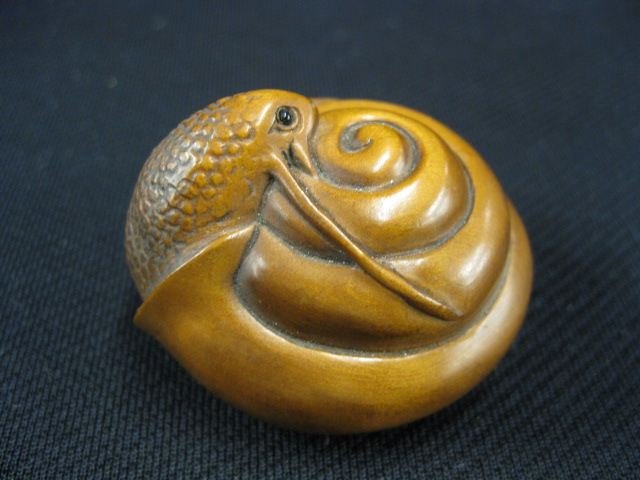 Carved Wood Netsuke of a Snail,: in his shell, onyx eyes, signed, 1 3/4, excellent."