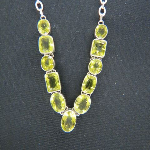 Lemon Citrine Necklace,: 11 fancy cut gems totaling over 200 carats in sterling silver, up to 18" long, 66 grams.