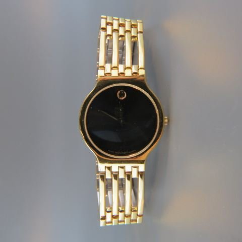 Movado Man's Wristwatch,: gold finish, quartz, unused.
