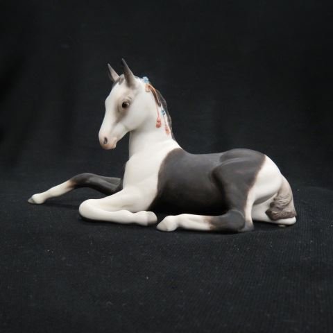 Cybis Porcelain Figurine of a Colt,: at rest, 8 1/2" long, excellent.Cybis®, recognized by collectors and connoisseurs throughout the world for its unsurpassed beauty, offers today's collector a timeless symbol of elegance and taste. Ea
