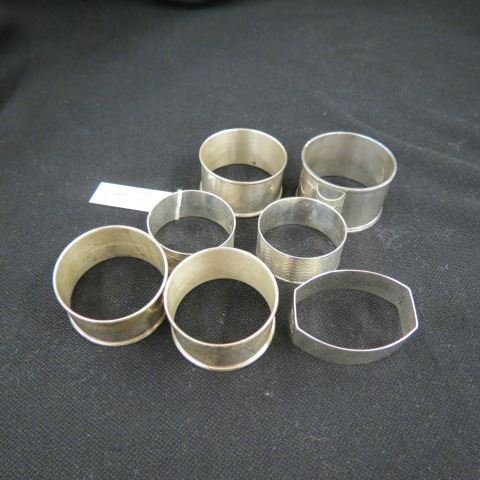 7 Sterling Silver Napkin Rings,: various designs.