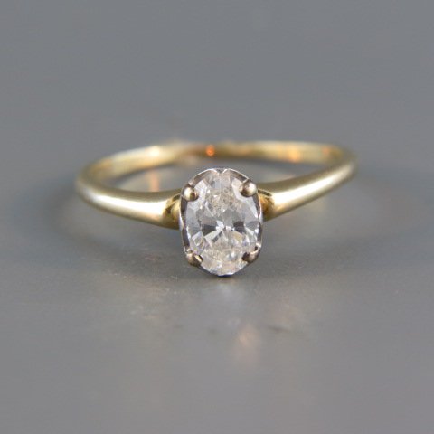 Diamond Solitaire Ring,: .56 oval diamond, high grade, 14k yellow gold Tiffany style setting, with appraisal of $3,250.00, currently size 7.