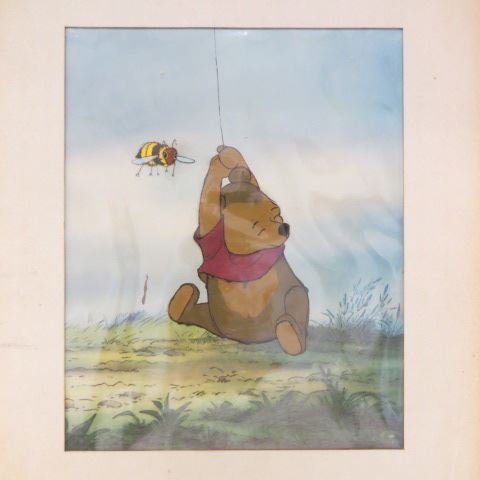 Vintage Walt Disney Cel "Winnie the Pooh",: approx. 10" x 12", a fine example, original, with label.A cel, short for celluloid, is a transparent sheet on which objects are drawn or painted for traditional, hand-drawn animation. Actual celluloid