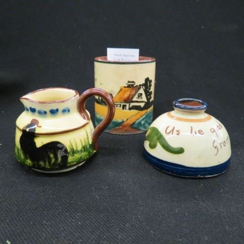 3 pcs Torquay Pottery: sayingsware, inkwell, creamer, 3" piece...Torquay is the generic name for the many potteries in South Devon that made red earthenware pots - usually quite small - with slip decoration in the form of a