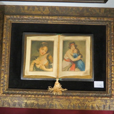 2 pcs. Artwork;: small oil painting of a child together with a framed plaster book opened to pages depicting famous paintings.