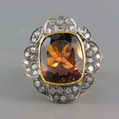 Tourmaline & Diamond Ring,: rich cushion cut red brown 8 carat gem surrounded by diamonds totaling .55 carat in gold & silver setting, currently size 7 1/2.