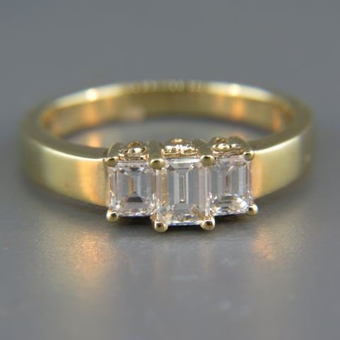Diamond Ring,: 3 emerald cut diamonds totaling 1 carat in 14k yellow gold, high grade, with appraisal of $4,350.00, currently a size 7 1/4.