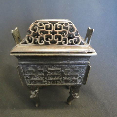 Chinese Bronze Censer,: signed, foo dog legs, elaborate carved wood openwork top, 7" x 8"...A censer is a bowl made to hold burning incense, often crafted from bronze, copper, porcelain, or stone. The first Chinese vessels d