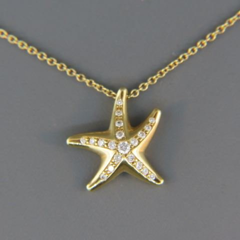 Tiffany Diamond Starfish Pendant,: by Elsa Peretti, 3/4" diameter with 16 diamonds in 18k yellow gold with 16" chain, signed.