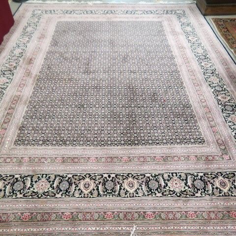 Silk Handmade Persian Type Room Size Rug: elaborate overall on indigio field, tightly woven, 32 borders of various designs, 7'10" X 10'1", excellent condition, originally cost over $16,000.00