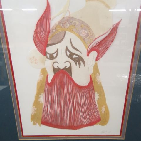 Oriental Artwork by Wang,: cut paper collage of a man, signed & dated 1986, 10" x 14".