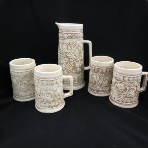 5 pc. Weller Art Pottery Beverage Set,: 9 1/2" pitcher & 4-5" mugs, 1920's just typical crazing.Weller Pottery began production in 1872. Weller was founded by Samuel Weller. In 1895, Weller pottery purchased Lonhuda Pottery. With the additi