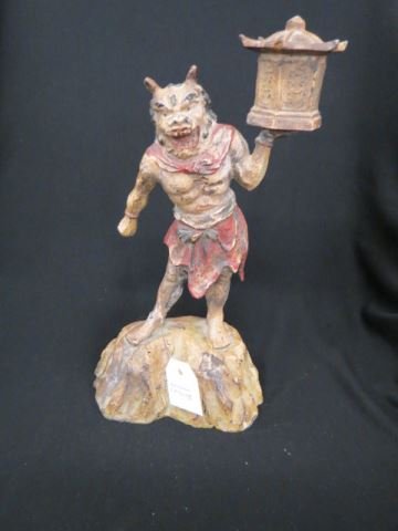 Cast Iron Figural Doorstop of a Devil,: standing on rock holding a Japanese lantern, 12 1/2".