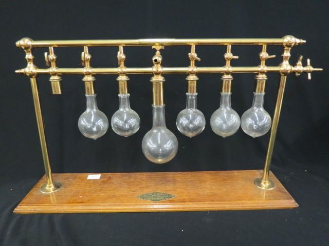 Dr. John Robinson's Multiple Comminuter,: bulb shape recepticles, 30" wide, oak base, lacks one glass, from The Pneumachemic Company, Cincinati, Ohio, 1895.