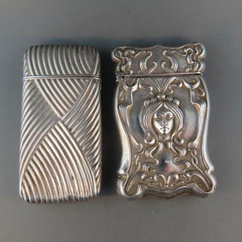 2 Sterling Silver Match Safes,: Art Nouveau lady by Gilbert and wrapped example by Howard.