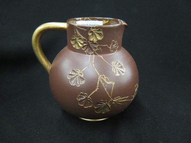 Rookwood Experimental Art Pottery Pitcher,: 1885 by Anna M. Valentien (Brickmaker), incised floral, gold trim, red clay, 5 1/4", excellent....Rookwood Pottery of Cincinnati was the first to gain artistic recognition and respect for the United S