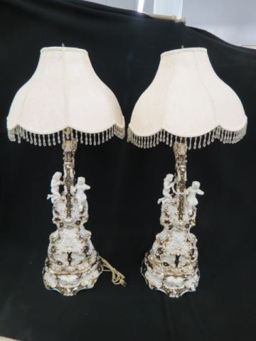 Pair of Capodimonte Figural Lamps,: violin form with cherub or putti decoration, 24" body, silk & crystal shades.