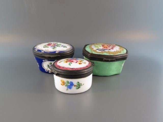 3 Battersea Enamel Boxes,: oval & round, florals & bird, 19th century.