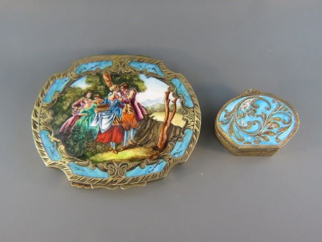 2 Enameled Silver Boxes,: compact with romantic scene and oval blue pill box, .800 fine with gold wash.