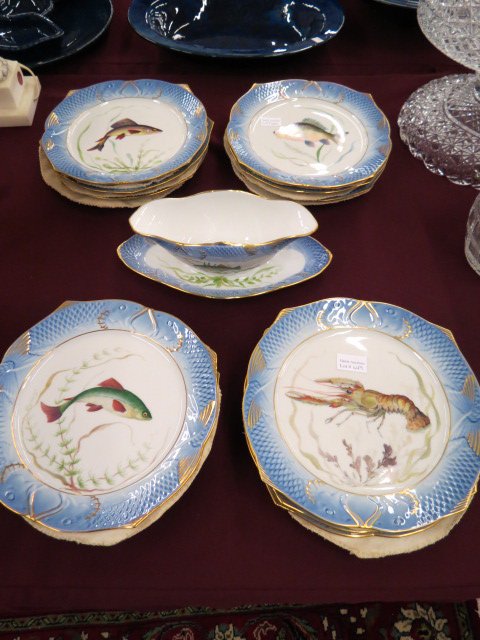 Royal Copenhagen Fish Set,: 12 plates with aquatic designs, 9.5" diameter, and a sauce boat with attached underplate, excellent....Royal Copenhagen, officially the Royal Porcelain Factory (Danish: Den Kongelige Porcelænsfabrik)