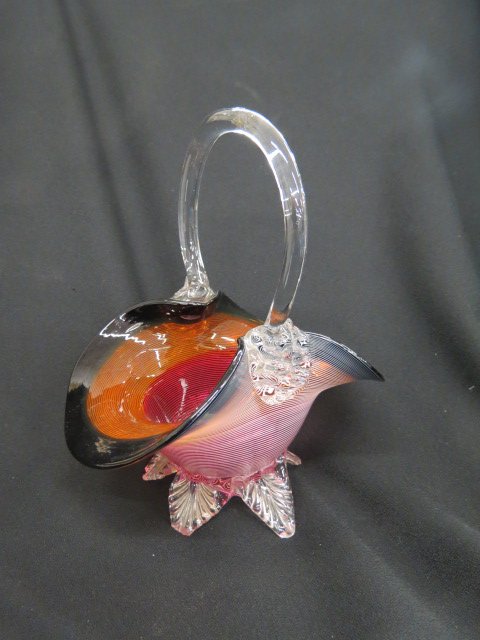 Victorian Art Glass Basket,: cranberry, amber, and black threaded body, clear feet and handles, 10.5", attributed to Stevens and Williams.