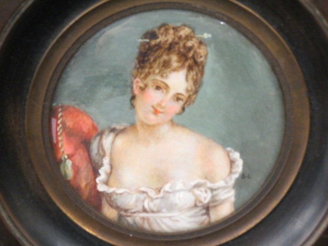 Miniature Painting on Ivory of Young Lady,: low cut dress, 3" diameter image, signed S.L., 19th century.