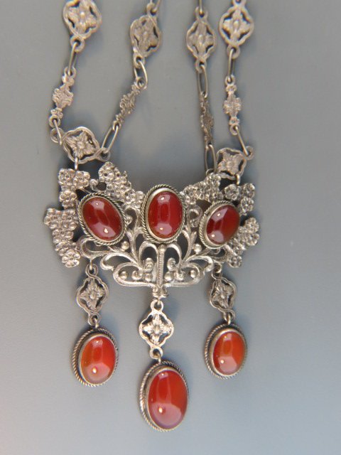 Peruzzi Silver and Carnelian Necklace,: 6 rich cabochons, ornate setting, famous Italian designer, .800 fine, 18" long....Designer information: The Peruzzi family has been producing high quality jewelry and fashion accessories in Italy for 