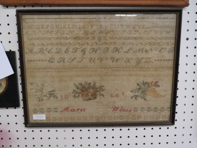 1868 Sampler,: Alphabet and florals, by Marie Weiss, 17" X 13"...Take a look at the history of samplers through the ages, and investigate the different styles and techniques used in their construction at different p
