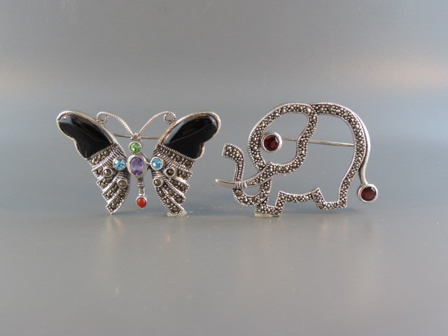 2 Sterling Silver Brooches,: marcasite and gem set, figural butterfly and elephant.