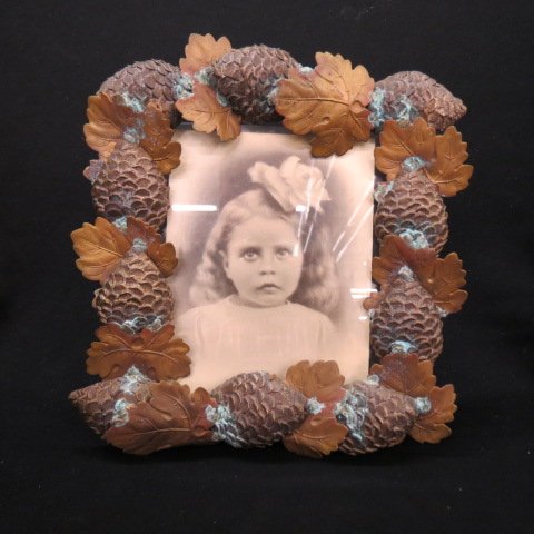 Ornate Brass Pinecone Frame,: image of young girl, overall 9" x 10".