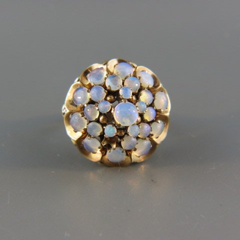 Opal Ring,: 25 fiery blue green gems in 14k yellow gold princess style setting.