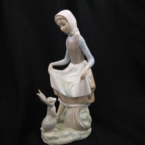 Lladro Porcelain Figurine,: of young girl with rabbits, 9".