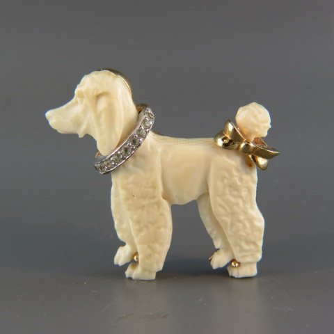 Carved Ivory Figural Poodle Brooch by Jomaz,: rhinestone collar, 1.5"....The Mazer Brothers, Joseph and Louis, began their jewelry business in Philadelphia, PA in 1917 and moved the jewelry establishment to NYC in 1927. Later, the company changed