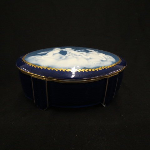 Limoges Pate-Sur-Pate Porcelain Box,: by T. Charaud, cherubs freeing a bird from its cage, resting on a cloud, 4.5" x 7", footed....The development of pâte-sur-pâte dates back to 1850 in France,[1] and an accident that occurred at the M