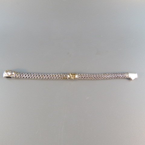 John Hardy Gold and Silver Bracelet,: Baby Bunny model, 4.5", in box....In the mid- 1970s, an art student from Canada traveling through Indonesia became enamored with the ancient jewelry-making techniques of the islands. He apprenticed wi