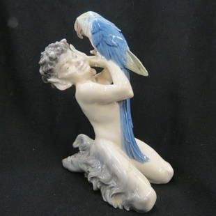 Royal Copenhagen Porcelain Figurine,: Faun with Parrot, #752, 7" tall, early mark.... 1775, The Royal Danish Porcelain Manufactory was founded by Frantz Heinrich Müller, a pharmacist experimenting with porcelain. He was looking for inves