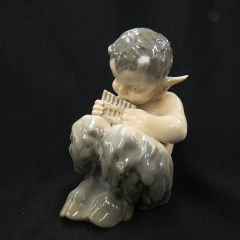 Royal Copenhagen Porcelain Figurine,: Faun Playing Syriax, #1736, 8.5"....Founded in 1775, Royal Copenhagen is one of the world's oldest companies, and for 240 years our products have been made with not only the deepest respect for tradit
