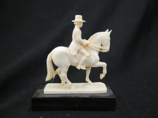 European Carved Ivory Figurine of: gentleman on horseback, 3" plus ebony base.THIS ITEM CANNOT BE SHIPPED INTERNATIONALLY.