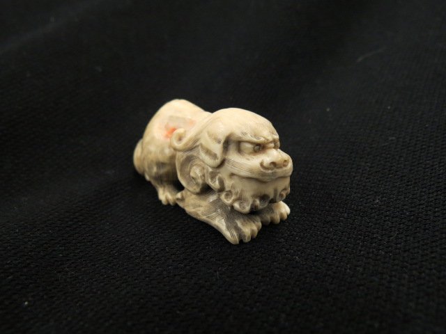 Carved Ivory Netsuke of a Foo Dog, (1 of 4)