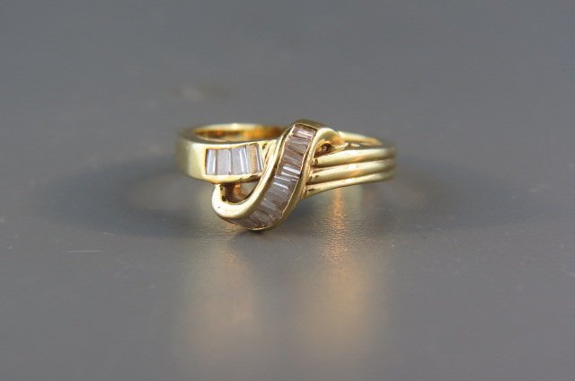 Diamond Ring,: baguette diamonds totaling .75 carat in 14k yellow gold, high grade, with appraisal of $2,000.00, currently size 7 1/2.