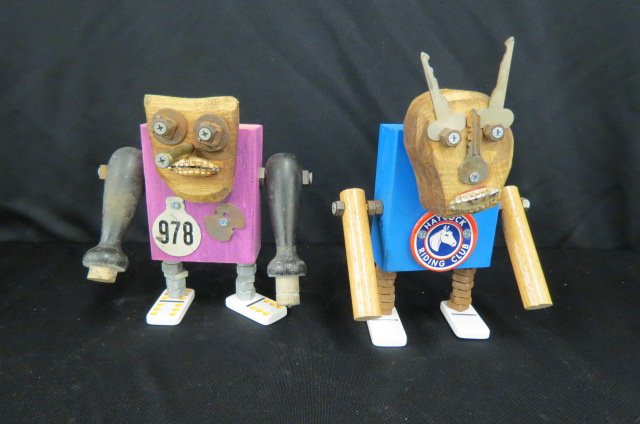 2 Mark May Folk Art Robot Figurines,: 8" & 9", titled, signed, dated 2007....Born in Belleville, Illinois, Mark May is a Special Education teacher who now lives in Reading, Pennsylvania. Mark originally created the Robots as a way of rele