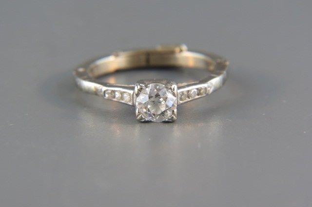 Diamond Ring,: .56 carat with 3 diamonds on each side, platinum with added 14k white gold finger fit shank, high grade, currently size 6.