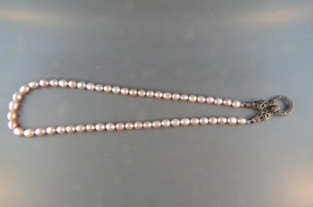 Pearl Necklace,: lusterous pink freshwater egg shape pearls, sterling silver and marcasite clasp, 16" long.