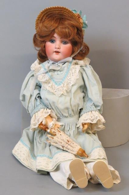 B.J. & Co. Bisque Head Doll "My Sweetheart",: blue-green and lace dress, straw hat, 23" tall....When bisque dolls began appearing in France during the 1850s, their matte finish offered a trendy, realistic alternative to the glossy china dolls pop