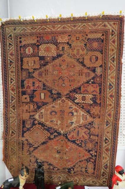 Caucausan Handmade Rug,: antique, geometric designs, primarily browns, blue and ivory, showing its age, 3'7" x 6'2".