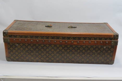 Louis Vuitton Trunk,: made specially for Encyclopedia Britannica, 4 compartments for the books, latched lift off top, top leather handle gone, monogram painted over, 35" long, 13" wide, 10" deep....Authentic Louis Vuitton