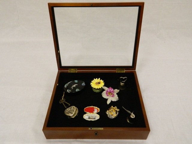 Display box with Various Small Trinket Boxes: Locking Display box with 2 keys is 13" x 10 1/2" and 3 1/2" tall. 8 Small trinkets are also included in the lot. Some are Limoges.