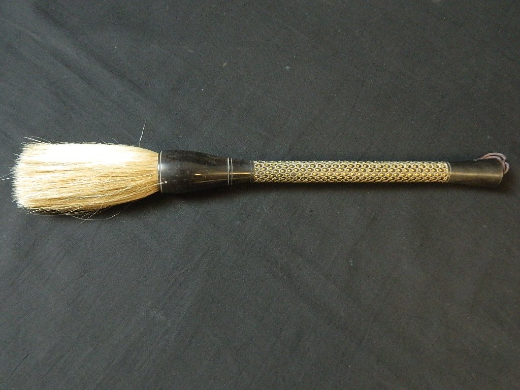 Vintage Chinese Calligraphy Snake Skin 15.5" Brush: Up for auction is a vintage Chinese calligraphy brush. The handle is made from snake skin. The brush is about 15 1/2" long. It is in great condition with a minor suff at the base of the handle.